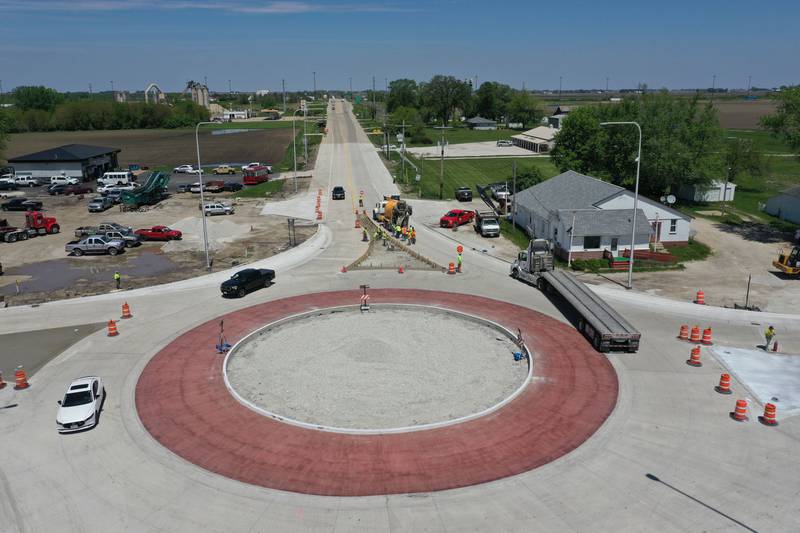 Crews pour concrete on the northern approach to the roundabout on Tuesday, May 16, 2023 at the intersection of Illinois Route 178 and U.S. Route 6 in Utica.