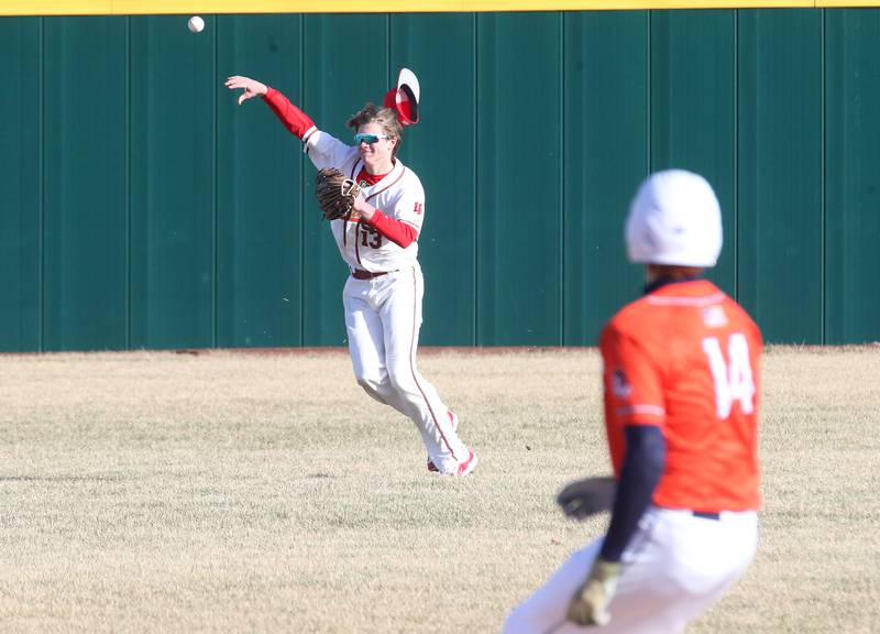 L-P left-fielder Braylin Bond throws the ball into the infield as Pontiac's Aiden Brummel takes second base on Monday, March 24, 2025 at Huby Sarver Field inside the L-P Athletic Complex in La Salle.