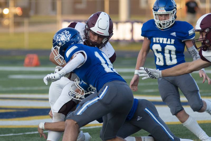 Newman’s Carter Rude makes a tackle in the backfield against Rockridge Friday, Sept. 2, 2022.