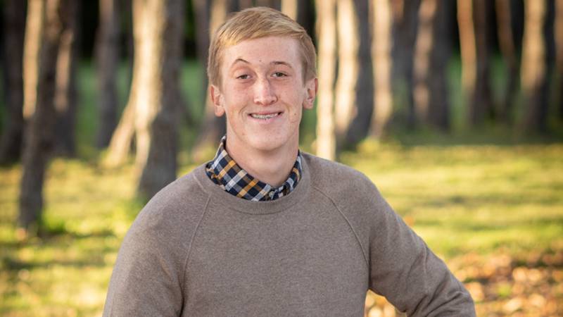 Woodstock senior Evan Neuhart received a Chick Evans Caddie Scholarship from the Western Golf Association which will cover four years of college.