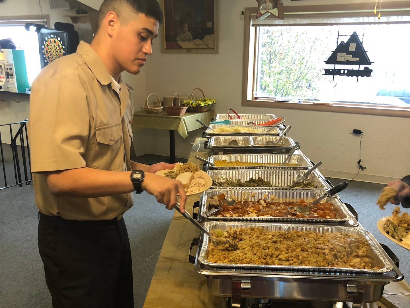 Alex Rebollar, 20, of Austin, Texas, gets seconds on Thursday, Nov. 24, 2022, at the Johnsburg Moose Lodge 691. He was one of 45 recruits from the Naval Station Great Lakes' Recruit Training Command who spent their Thanksgiving at the Moose lodge.