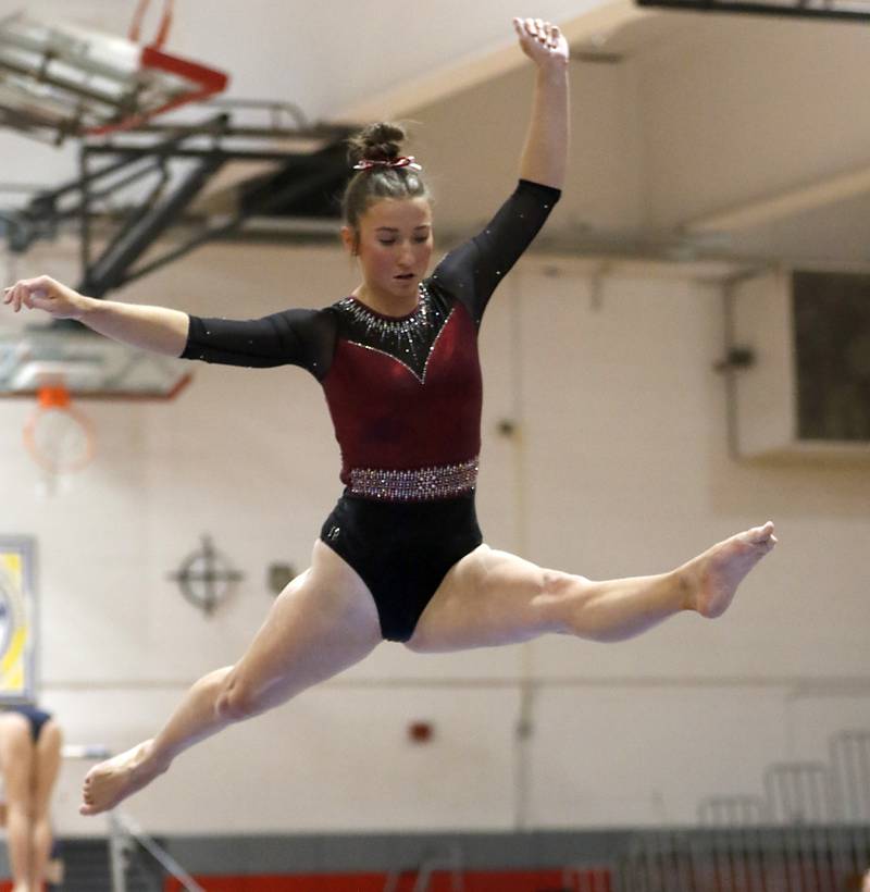 Prairie Ridge’s Thea Scheuer competes on the balance beam during the IHSA Mundelein Gymnastics Sectional on Feb. 13, 2025, at Mundelein High School.