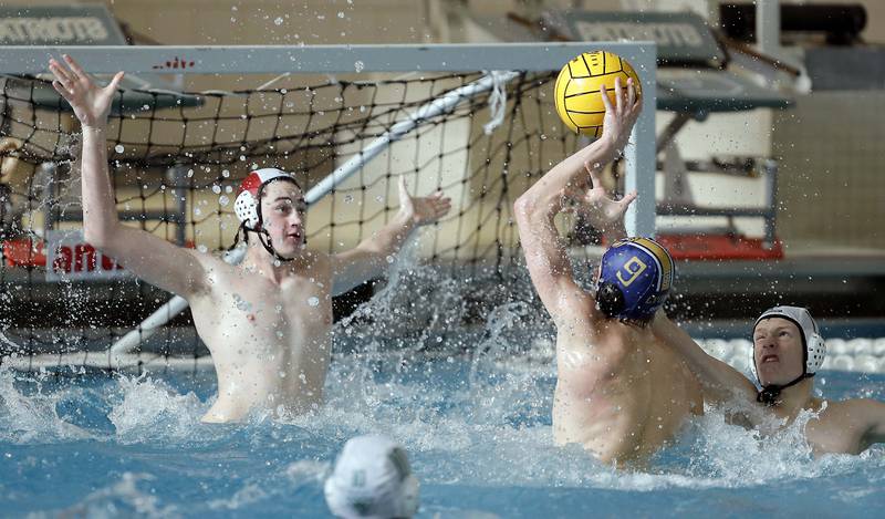 Lyons' Brendan Whelton (9) shoots against against the York during the IHSA State Water Polo consolation match Saturday May 20, 2023 at Stevenson High School in Lincolnshire.