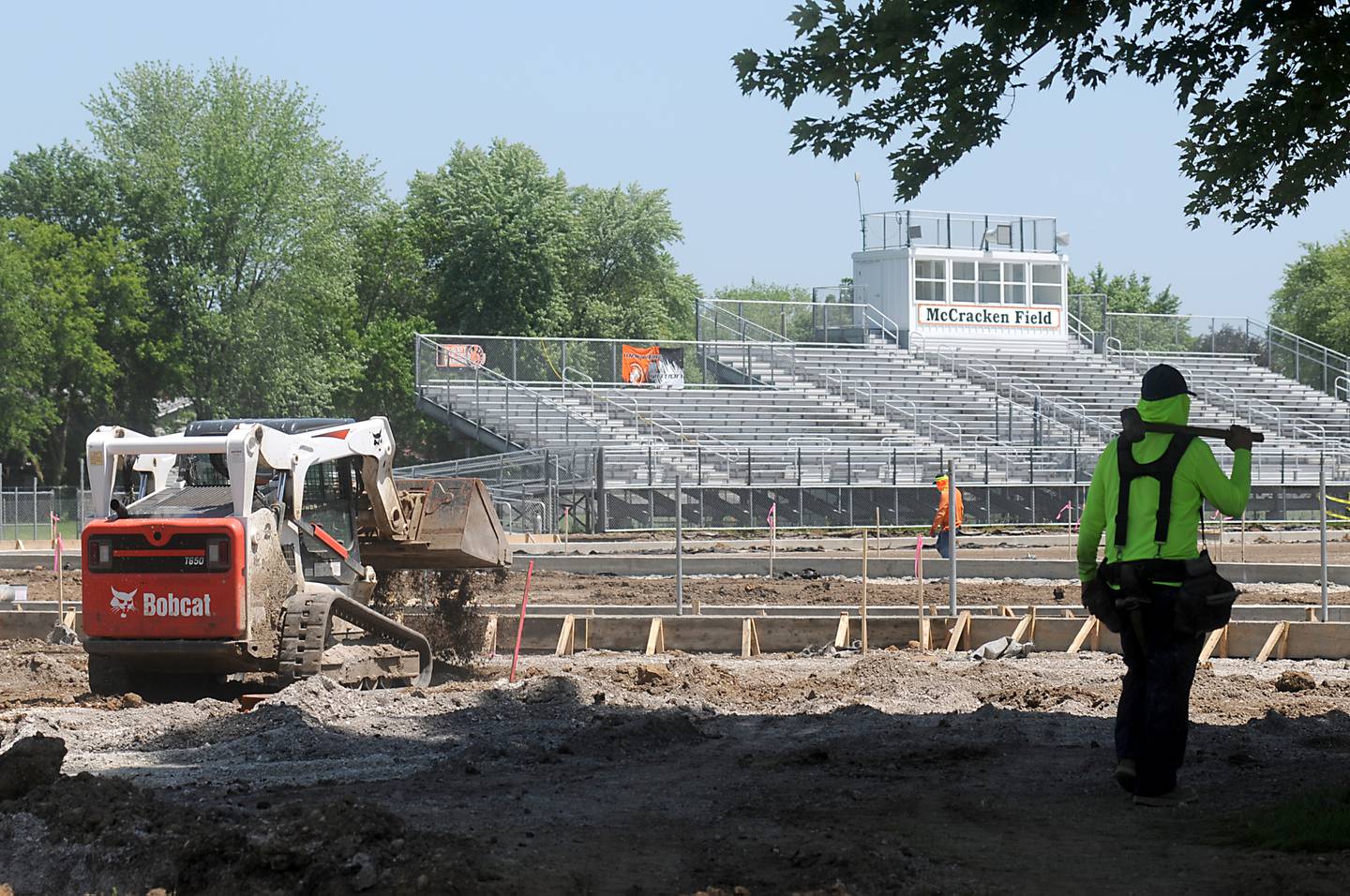 Workers from Herrera Construction work on setting up forms for concrete Tuesday, June 14, 2022, while upgrading McCracken Athletic Field in McHenry.