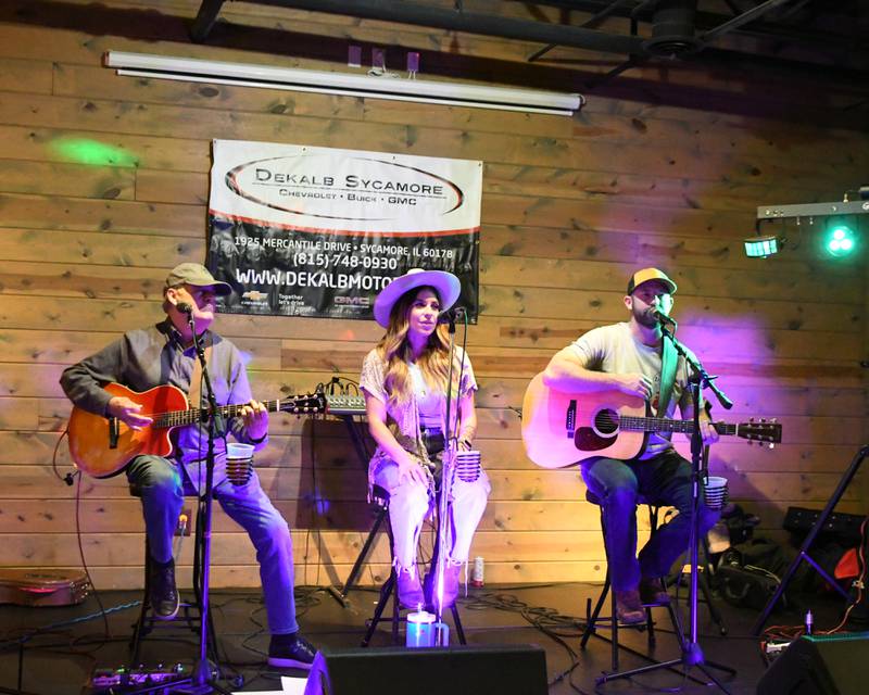Back Country Roads performs on Wednesday, Nov. 27, 2024, at Fatty's Pub and Grille in DeKalb during the DeKalb Fire Fighters Local 1236 union's annual Tip A Firefighter event to fundraise for the Muscular Dystrophy Association.