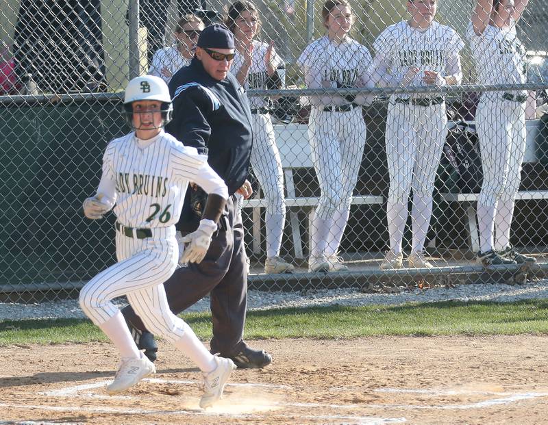 St. Bede's Emma Slingsby scores the teams first run against Midland on Thursday, March 21, 2024 at St. Bede Academy.