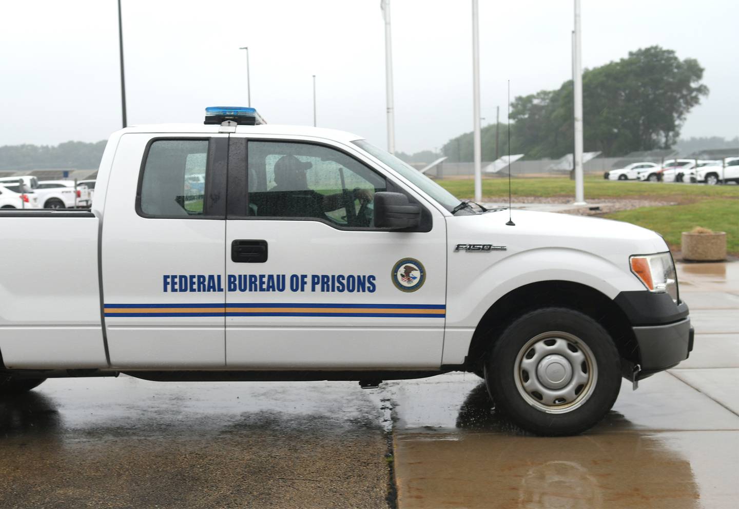 A prison guard patrols the exterior of the Thomson prison during Senator Dick Durbin's press conference on Friday, July 8.