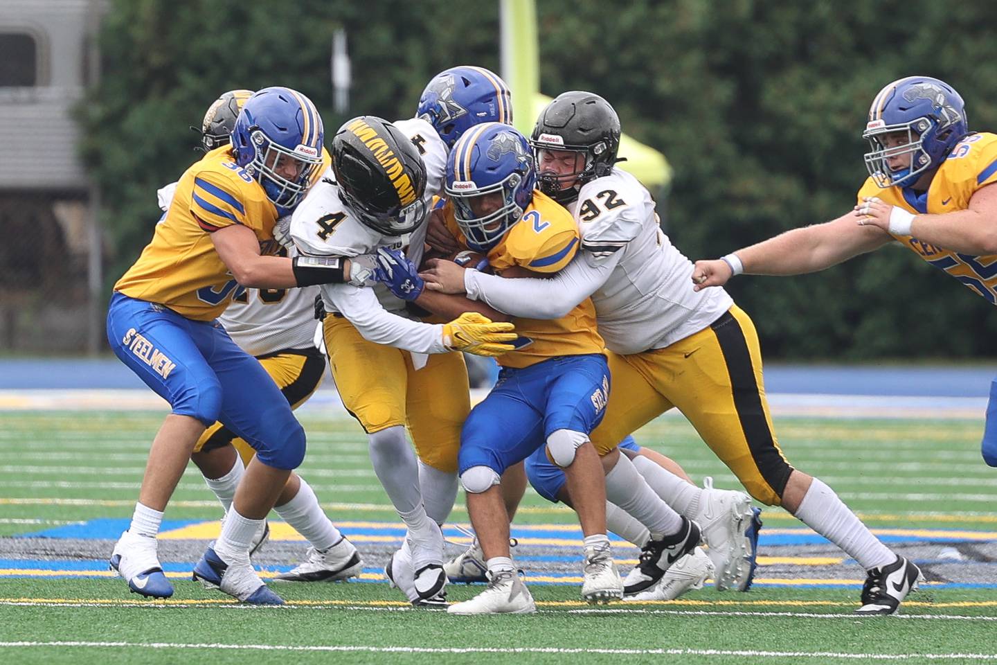 Joliet West’s Micah McNair, 4, and Zachary Cronk, 92, tackle Joliet Central’s Christian Smith for a loss on Saturday, Sept. 28, 2024 in Joliet.
