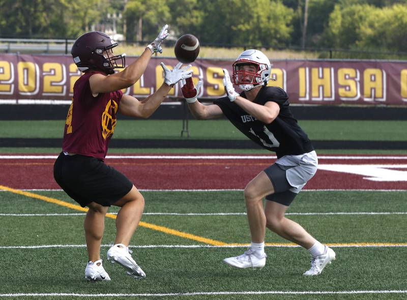 Richmond-Burton’s Hunter Carley tries to catch a pass during a 7 on 7 football practice Monday, July 14, 2025, at Richmond-Burton High School, with teams from Crystal Lake Central, Grayslake Central and Mundelein.