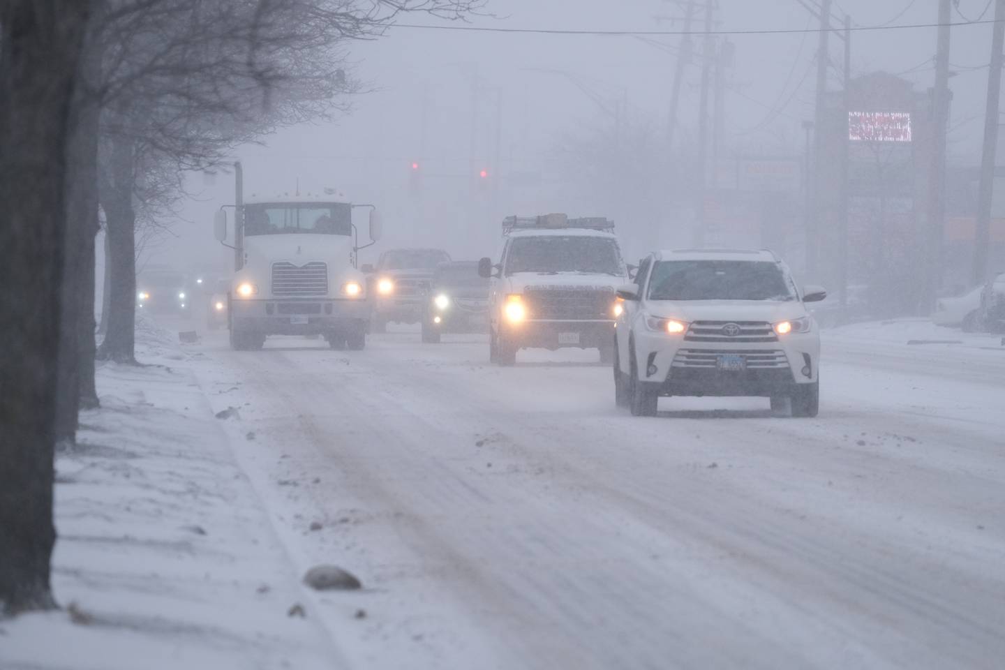 Heavy snow starts at the beginning of the evening rush hour along North Larkin Avenue. Thursday, Feb. 17, 2022, in Joliet.