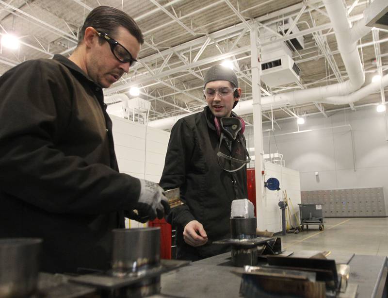 Karsten Illg, of Elgin, department chair and full-time welding instructor, helps Trevor Miksch, of Gurnee with his stainless steel welding project at the College of Lake County Advanced Technology Center (ATC) on November 16th in Gurnee.
Photo by Candace H. Johnson for Shaw Local News Network
