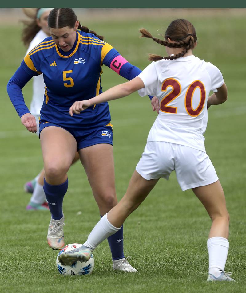 Johnsburg's Elaina Moss battles with Richmond-Burton's Ella Seyller for control of the ball during the Kishwaukee River Conference Girls Soccer Tournament Championship match on Wednesday, May 6, 2026, at Johnsburg High School.