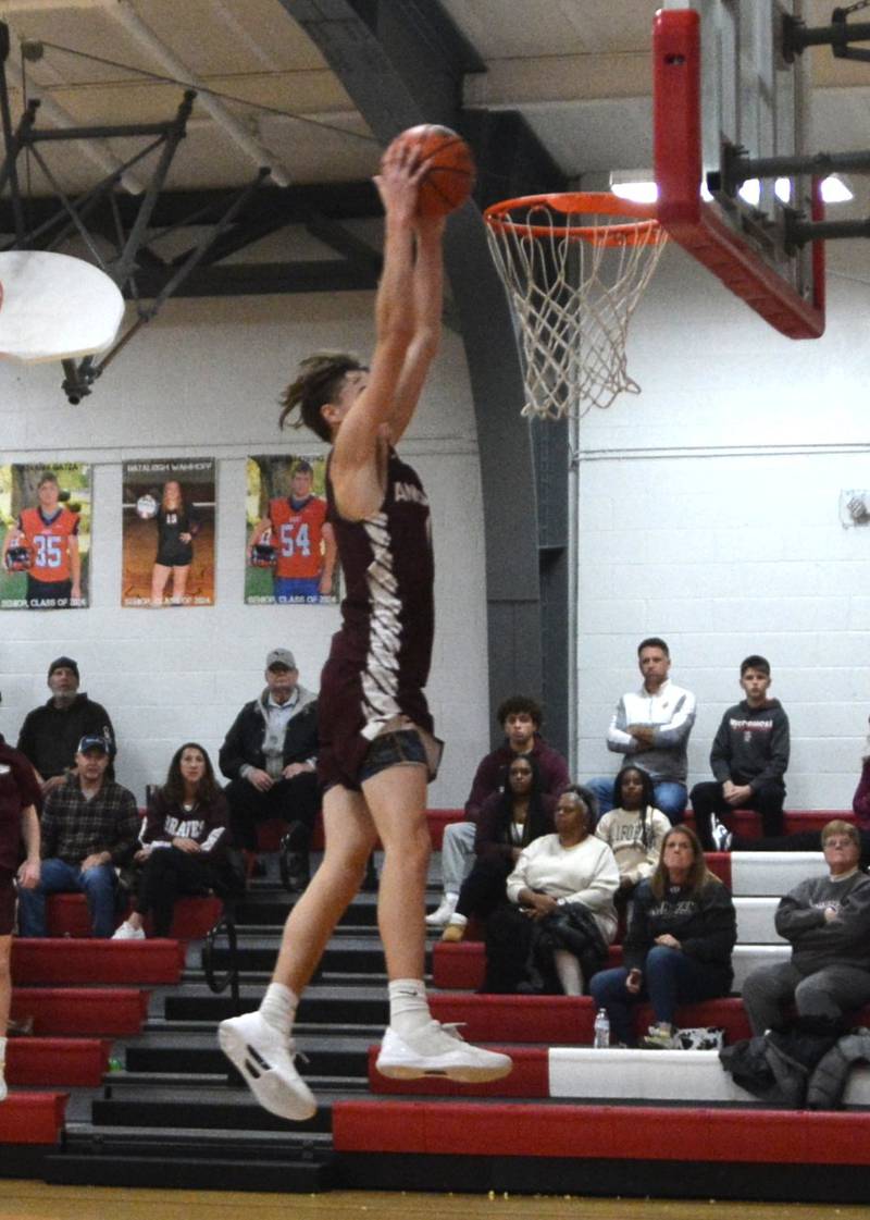 Annawan's Gabe Sims throws down a dunk against Lowpoint-Washburn in the championship game of the LaMoille Holiday Classic on Friday. The Braves won 51-45.