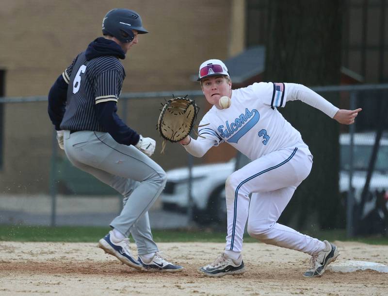 Hiawatha's Aidan Cooper gets back to first as Parkview Christian Academy's Oliver Malkowski catches the throw on a pickoff attempt Thursday, April 17, 2025, during their game at Hiawatha High School in Kirkland.