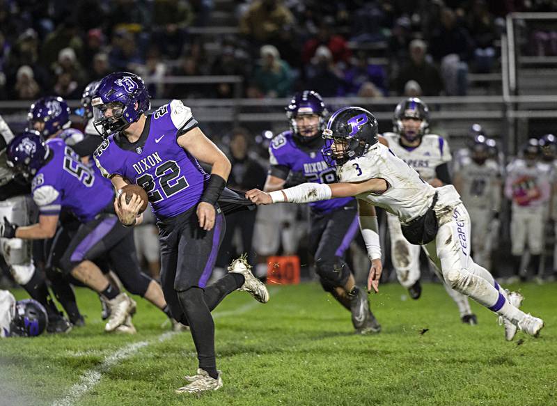 Dixon’s Aiden Wiseman gets away from Plano’s Noah Uhrich in a first round playoff game against Plano Friday, Oct. 27, 2023 in Dixon.