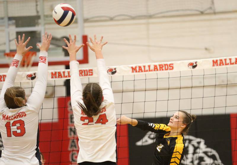 Putnam County's Ella Pyszka spikes the ball over the head of Henry-Senachwine's Grace Anderson and teammate Harper Schrock on Thursday, Aug. 28, 2025 at Henry-Senachwine High School.