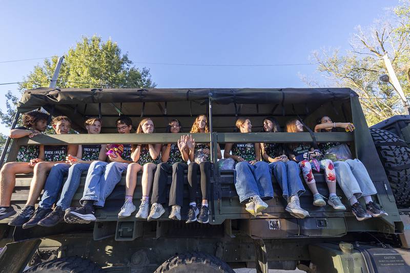 Members of the Rock Falls cross country team ride through the homecoming parade Thursday, Sept. 25, 2025.