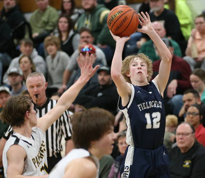 Fieldcrest's Jordan Heider shoots a jump shot over Putnam County's Austin Mattingly on Tuesday, Feb. 7, 2023 at Putnam County High School.
