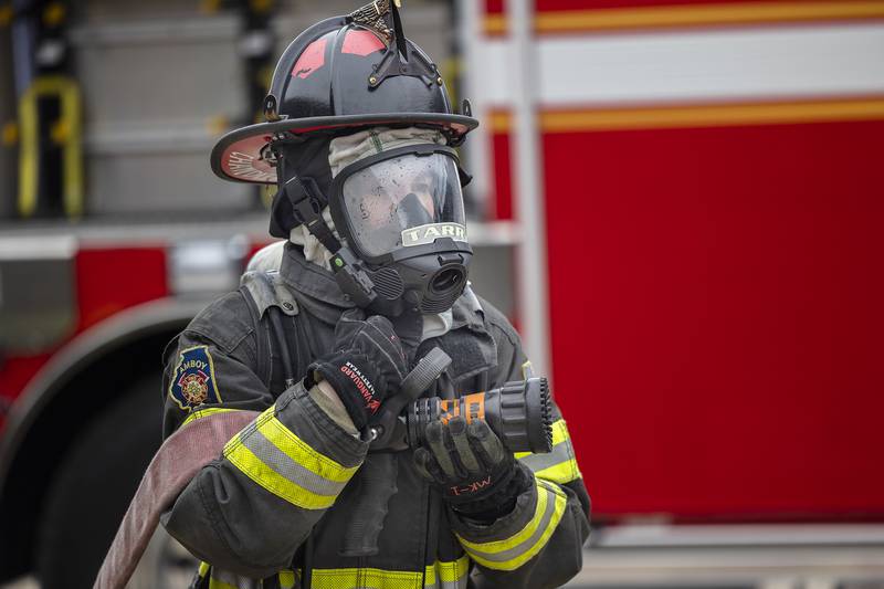 Emma Chandler, 18, of Amboy, removes a hose from a training session Saturday, March 15, 2025. Chandler will go on to make this a career along with EMT school.