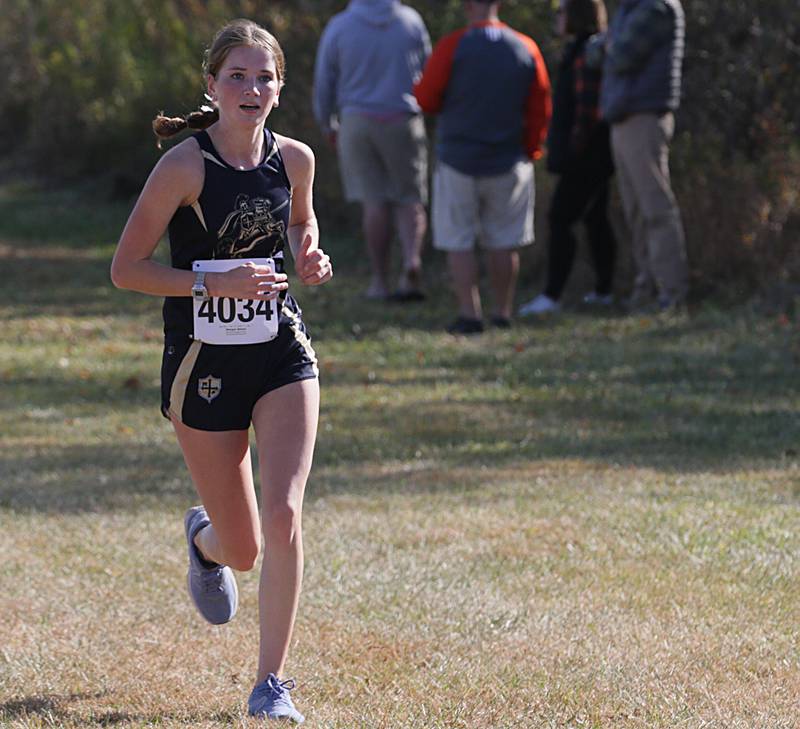 Marquette's Morgan Nelson runs in the Class 1A Regional Cross Country gils race on Saturday, Oct. 22, 2022 at the Seneca FFA Farm in Marseilles.