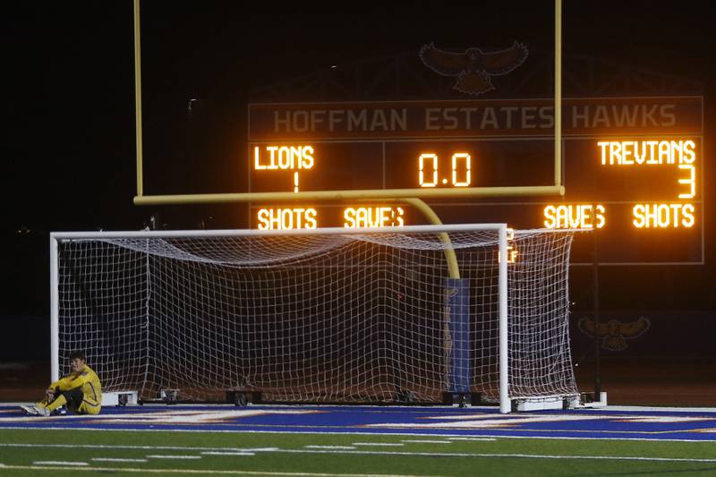 Lyons Township's Tyler Balon sits in the goal after Lyons Township lost to New Trier in the IHSA Class 3A state championship soccer match on Saturday, Nov. 4, 2023, at Hoffman Estates High School.
