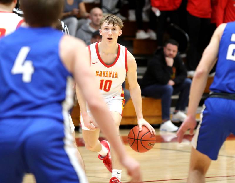 Batavia’s Nate Nazos drives toward the basket during a game against Geneva at Batavia.