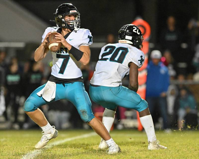 Woodstock North's Parker Halihan looks for an open receiver against Kishwaukee River Conference and crosstown rival Woodstock on Friday, Oct. 25, 2024 at Woodstock H.S.