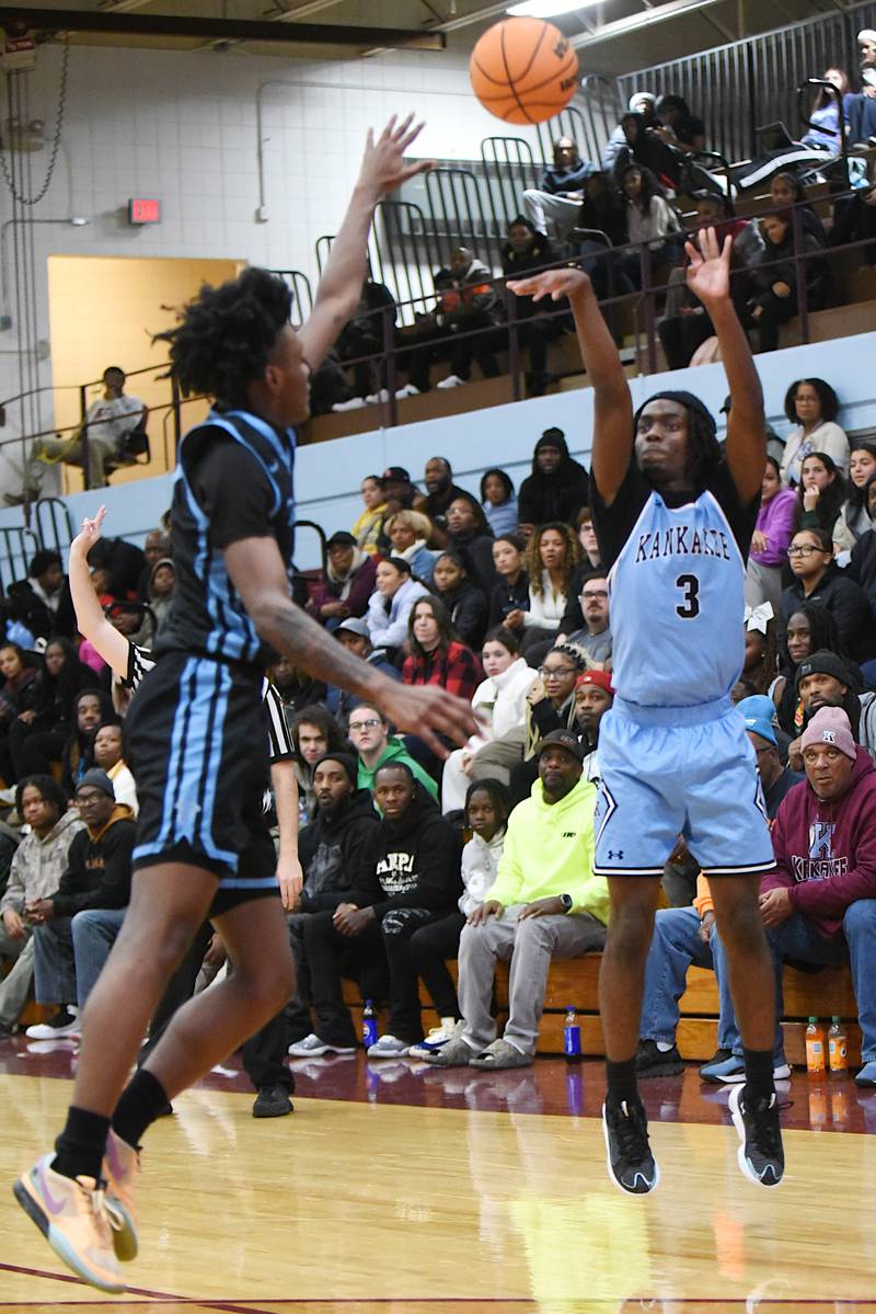 Kankakee's Cedric Terrell III, right, shoots a 3-pointer over a Thornridge defender during a game at Kankakee Friday, Dec. 5, 2025.