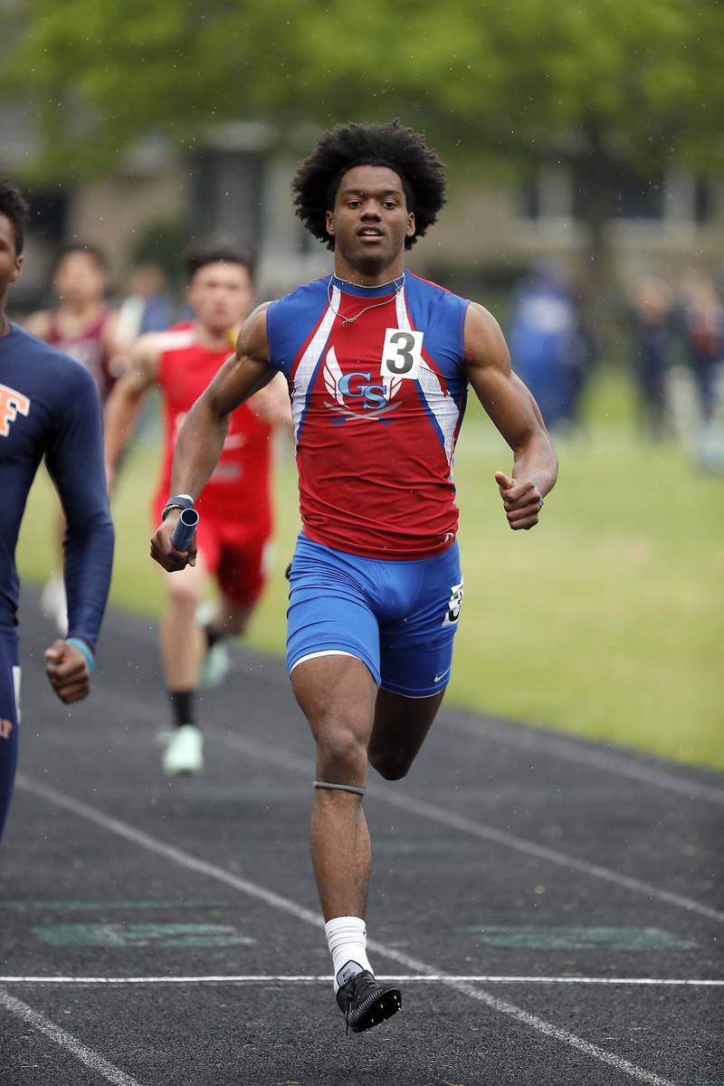 Cam Williams of Glenbard South competes in the 4x100m relay during the 41st Jim Arnold Invitational Saturday April 29, 2023 in Glen Ellyn.