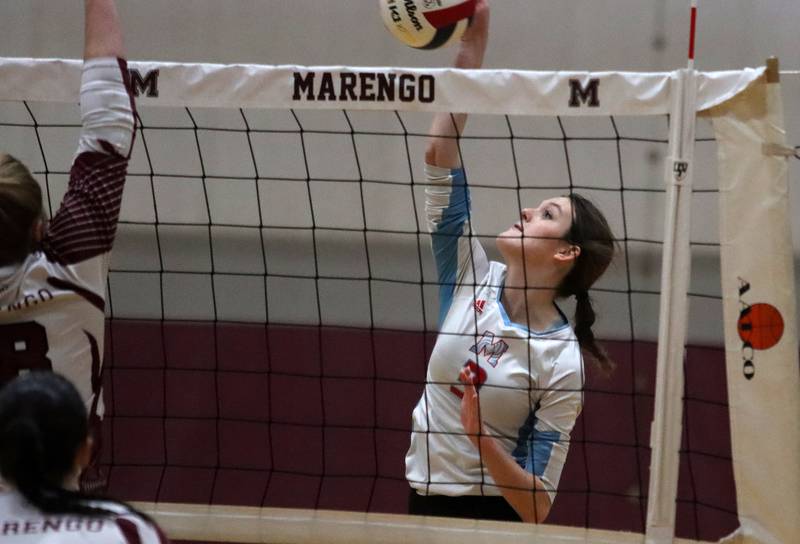 Marian Central’s Mary Kate Hernon hits the ball in IHSA Class 2A Regional volleyball action on Monday, Oct. 28, 2024, at  Marengo High School  in Marengo.