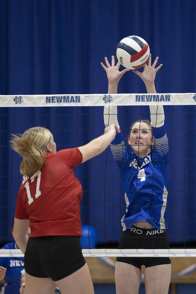 Newman’s Ruby Burger goes for a block against Hall’s Caroline Morris Tuesday, Oct. 21, 2025.