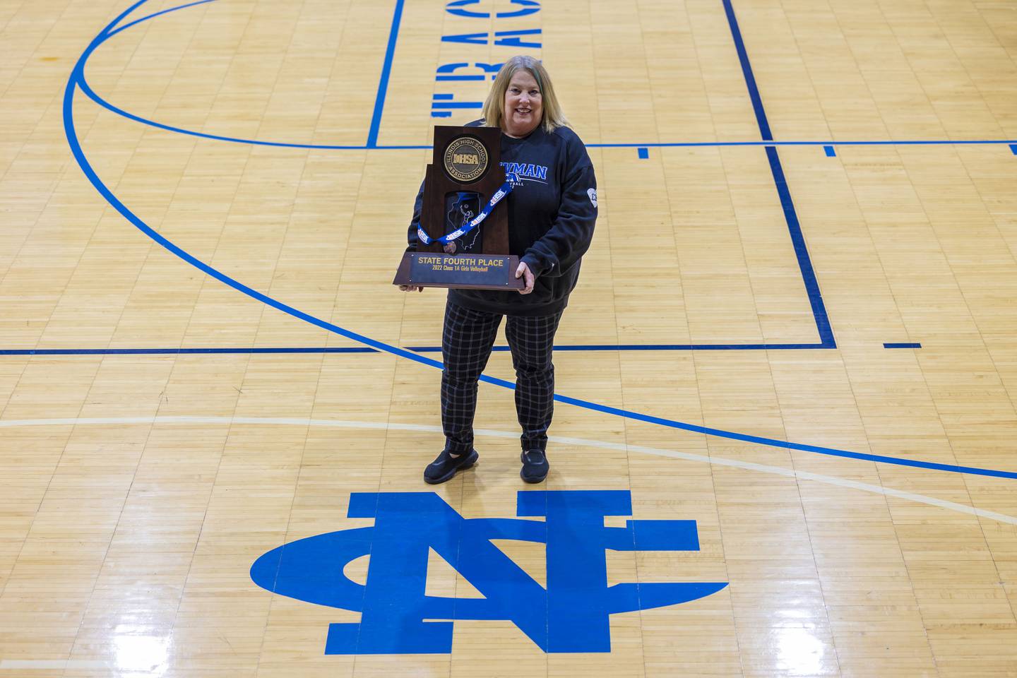 Newman’s Debbi Kelly led the Comets to a fourth place finish at the state volleyball tournament.