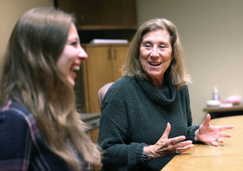 CASA DeKalb County Executive Director Jill Olson (right) talks to Emma Warner, grant and marketing coordinator with CASA, Wednesday, Nov. 8, 2023, in the conference room at their office in Sycamore.
