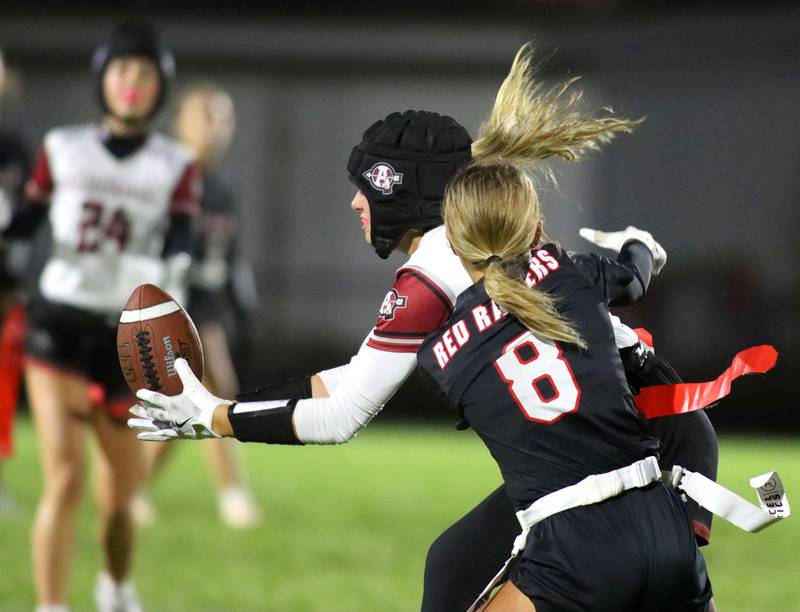 Antioch’s Reese Queensland snags an interception in front of Huntley’s Addison Avi in IHSA Regional varsity flag football action at Crystal Lake Central High School in Crystal Lake on Wednesday, Oct. 8, 2025.