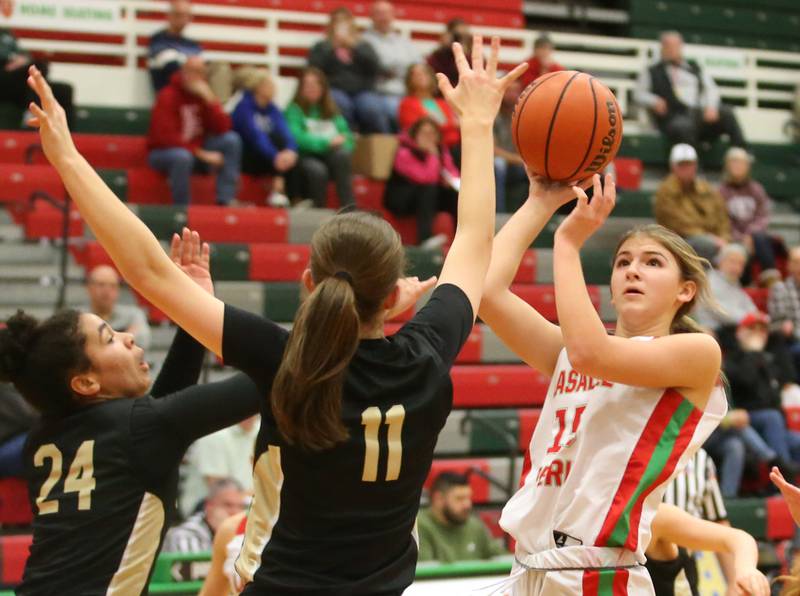 L-P's Kelsey Frederick eyes the hoop as Sycamore's Monroe McGhee and Megan Brannon defend on Thursday, Feb. 1, 2024 at Sellett Gymnasium.
