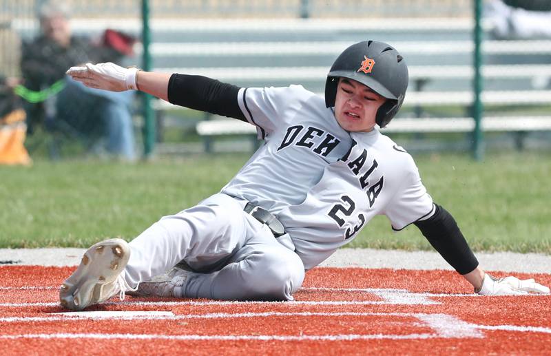 DeKalb's William Klumpp slides safely into home scoring a run during their game against Kaneland Friday, April 15, 2022, at Kaneland High School in Maple Park.