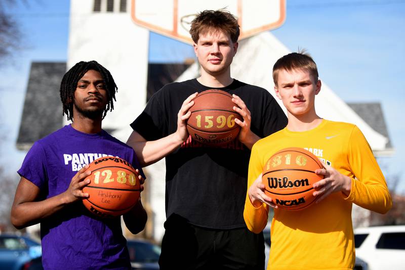 From left, Manteno's Ray Lee, Bradley-Bourbonnais' Nick Allen and Grant Park's Blake Brown, all the new all-time scoring leaders at their respective schools,  stand with basketballs that reflect their career point totals.