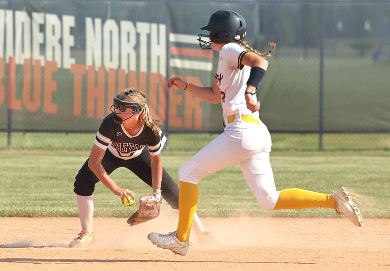 Sycamore's Haley Von Schnase flips the ball to second as Sterling's Olivia Melcher runs by during their Class 3A sectional championship game Friday, June 2, 2023, at Belvidere North High School.