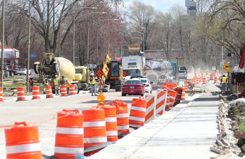 Crews pour a new sidewalk along U.S. 6 in front of the Westclox building on Monday, April 7, 2025 in Peru. The $6.4 million project is scheduled to be completed this summer, according to the release.
