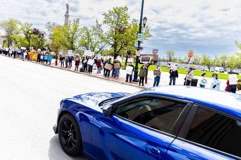 Attendees line Jefferson Street in Downtown Joliet during the May Day Weekend Rally on May 3, 2025.