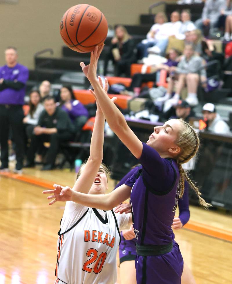 Dixon’s Kait Knipple shoots over DeKalb's Olivia Schermerhorn during their game Monday, Jan. 23, 2023, at DeKalb High School.