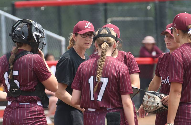 Lockport head softball coach Marissa Chovanec talks to her team during the Class 4A third-place game on Saturday, June 14, 2025 at the Louisville Slugger Sports Complex in Peoria.