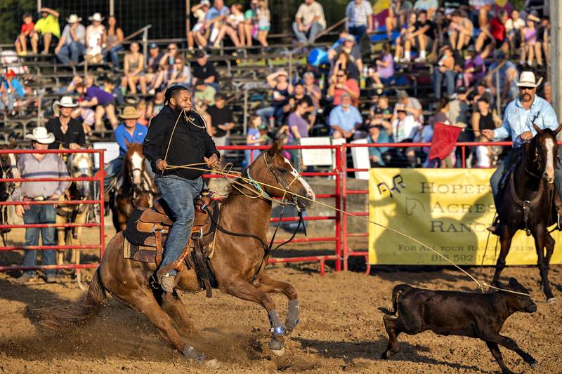 Darius Bawdy throws a lasso in the calf roping event Thursday, August 7, 2025, at Carroll County Fair’s T and A Bucking Bulls Rodeo.