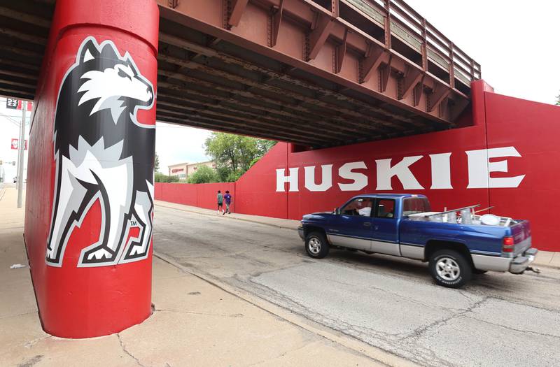 A vehicle drives by the new Huskie mural Monday, Aug. 7, 2023, on the Annie Glidden Road railroad underpass, just south of Lincoln Highway in DeKalb. The mural was a joint project between the City of Dekalb and Northern Illinois University.