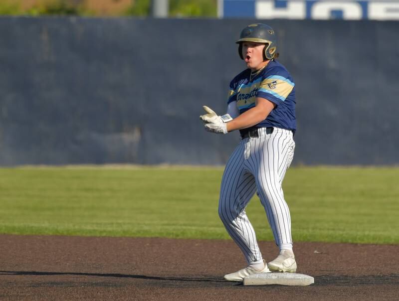 Marquette Academy's Krew Bond (12) celebrates his RBI double against Chicago Hope Academy during the 1A baseball sectional semifinal at Judson University in Elgin on Thursday, May 25, 2023.