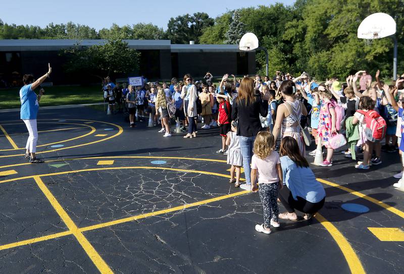 Principal Beth Klinsky talks to students on the first day of school at West Elementary School in Crystal Lake on Wednesday, Aug. 16, 2023.