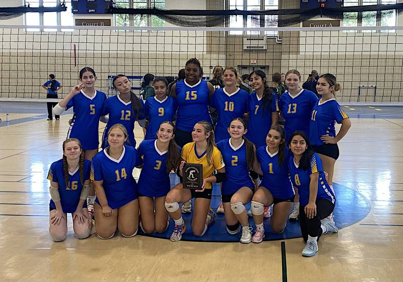 The Joliet Central volleyball team poses with its plaque after taking second place at the Peg Bryan Invitational.