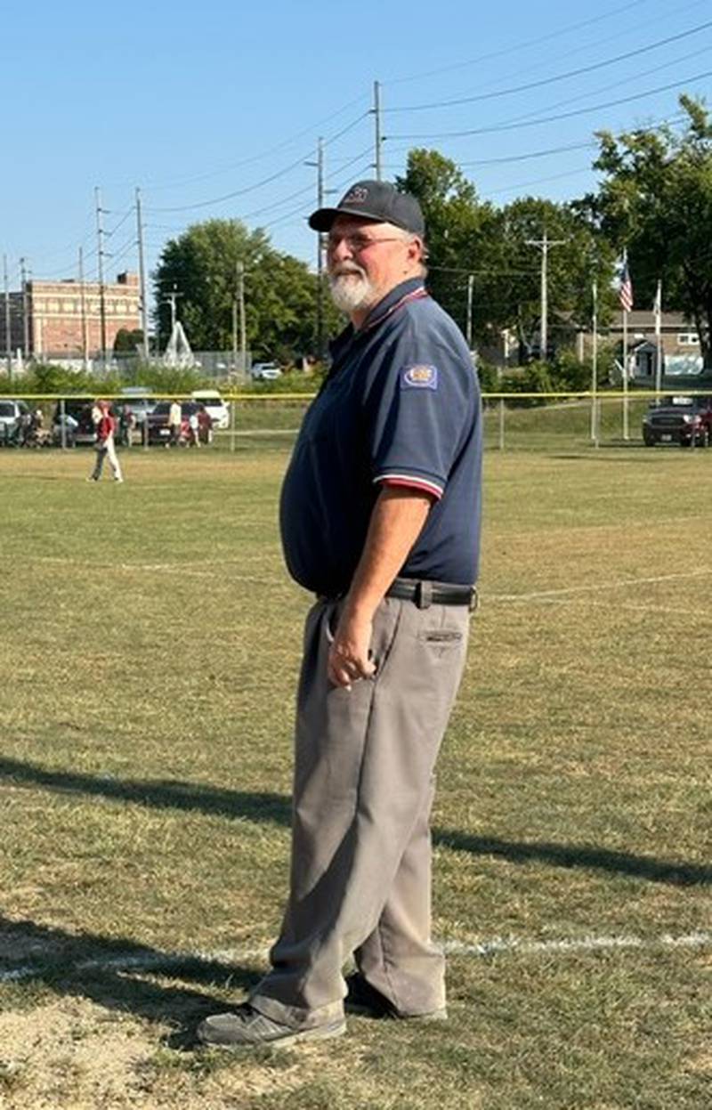 David Elliott of Marseilles umpired his final game recently after 25 years of service in the community and around the Illinois Valley.