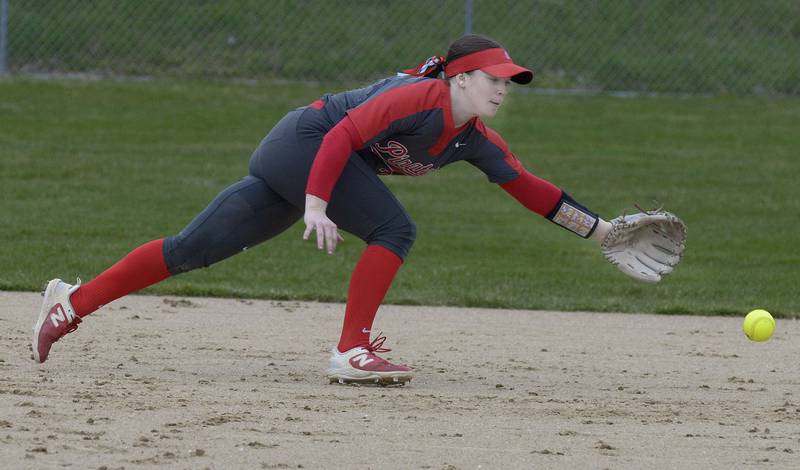 Ottawa’s Maura Condon reaches for a ground ball in the 3rd inning Friday against Reed Custer at Ottawa.