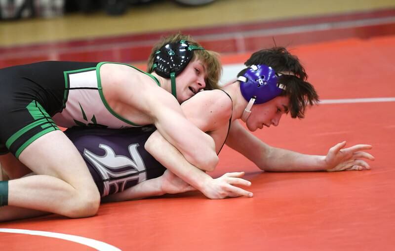 Rock Falls' Aaron Meenen (top) wrestles Dixon's Gavin Kramer in their 120-pound match at the 1A Oregon Wrestling Sectional on Friday night.